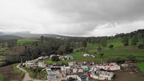 Aerial-dolly-in-over-rural-estate-in-Mexico-countryside-at-day