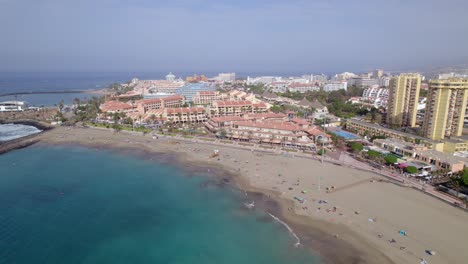 Playa-de-las-Vistas,-Tenerife,-Canary-Islands,-Spain,-Drone-Aerial-View-of-Sandy-Beach,-Upscale-Hotel-Resorts-and-Waterfront-Buildings-on-Atlantic-Ocean