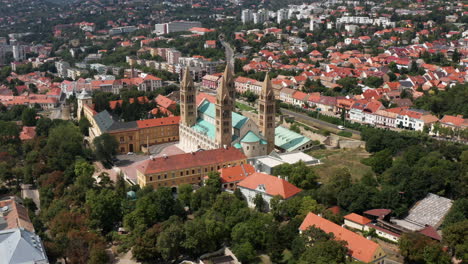 Aerial-View-On-Pecs-City-Historic-Downtown-And-Basilica-In-Springtime---Unique-medieval-mood-city-in-Hungary---drone-shot