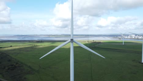 Alternative-green-energy-wind-farm-turbines-spinning-in-Frodsham-Cheshire-fields-aerial-view
