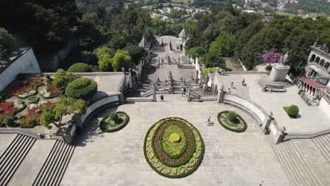 Aerial-tilt-up-view-Sanctuary-Bom-Jesus-iconic-Stairs-with-Braga-Scenic-Landscape