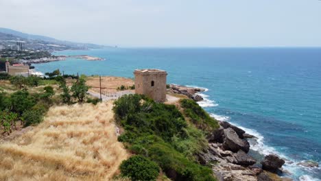 Glimpse-of-The-Guard-Tower-Of-The-Ancient-Structure-Of-The-Fidar-Crusader-Fortress-In-Lebanon---aerial-shot