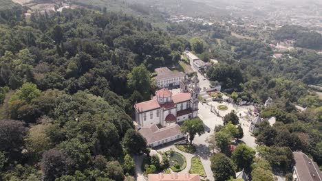 Aerial-top-down-view-Sanctuary-of-Bom-Jesus-Surrounded-By-nature,-hill-mountain---Braga