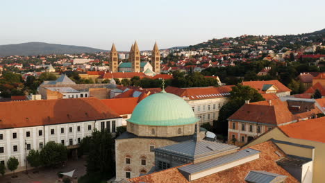 Mosque-Of-Pasha-Qasim-In-Pecs,-Hungary-With-Pecs-Cathedral-In-Distance
