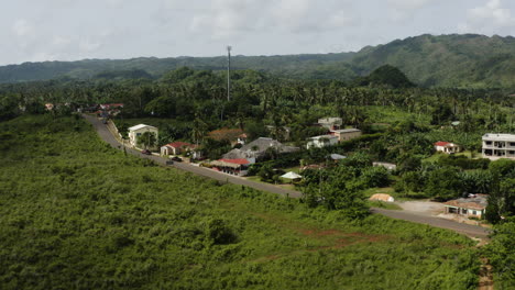 Smooth-aerial-pull-out-over-the-street-and-houses-surrounding-Playa-Rincon-in-the-Dominican-Republic