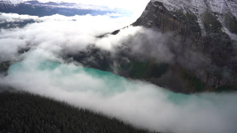 Lake-Louise,-Banff-National-Park-in-Alberta,-Canada,-Fog-Above-Turquoise-Glacial-Water,-Viewpoint-Panorama,-Full-Frame