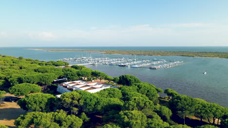 Boats-Moored-At-Marina-Nuevo-Portil-By-Piedra-River-From-Wedding-Venue-Surrounded-With-Verdant-Trees-In-El-Rompido,-Huelva,-Spain