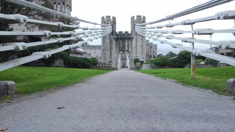 Conwy-castle-medieval-landmark-pathway-cables-engineering-low-angle-push-in