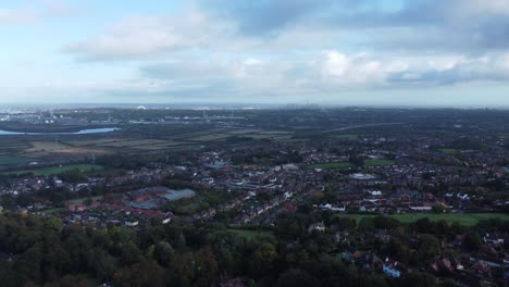Aerial-view-above-Halton-North-England-Runcorn-Cheshire-countryside-industry-landscape-pan-right-across-horizon