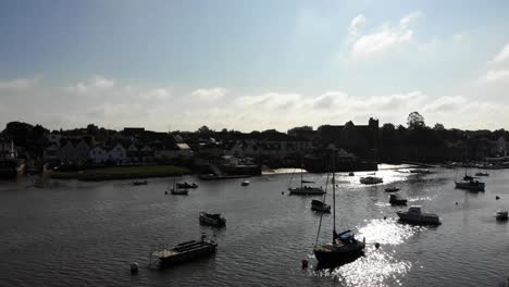 Aerial-View-Over-River-Exe-And-Topsham-Town-Backlit-By-Bright-Sun