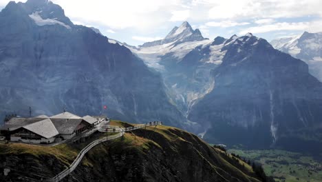 Aerial-flyover-over-Grindelwald-First-in-Switzerland-with-a-view-of-Schreckhorn-and-other-Bernese-Oberland-peaks