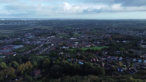 Aerial-view-above-Halton-North-England-Runcorn-Cheshire-countryside-industry-landscape-pan-left-tilt-down