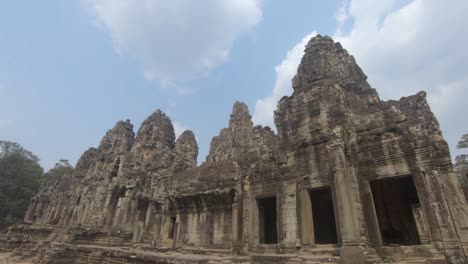Carved-stone-temple,-Angkor-Wat-,-against-blue-sky