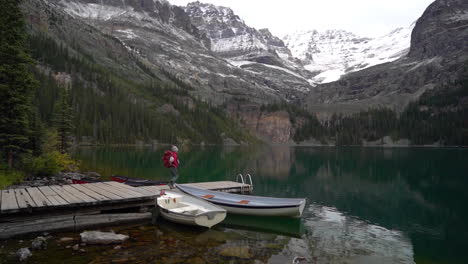 Female-Hiker-WIth-Backpack-on-Wooden-Dock-at-Lake-O'Hara