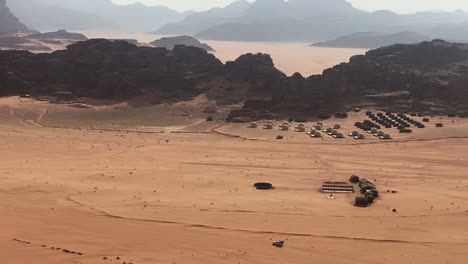 Vehicle-and-Bedouin-Camp-Tents-in-Wadi-Rum-Desert,-Jordan