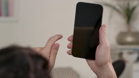Man-Holding-Mobilephone-Swipe-Screen-From-Right-To-Left