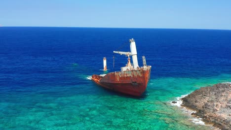 Establishing-shot-of-Nordland-shipwreck-in-paradisiacal-sea,-Greece