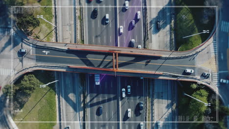 Aerial-top-down-of-busy-Pan-American-Highway-with-digital-glowing-lines-tracking-vehicles-at-daytime---Futuristic-concept-with-modern-gps-technology---South-America