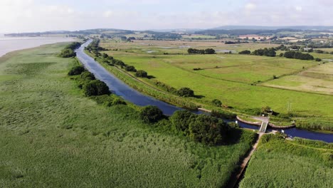 Scenic-Aerial-View-Over-Exeter-Canal-In-Topsham-Next-To-Green-Fields