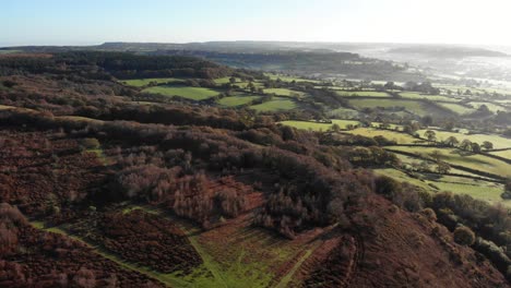 4K-Aerial-smooth-glide-over-the-amazing-trees-and-rolling-hills-of-Culmstock-Beacon-in-the-Blackdown-Hills-of-Devon-England