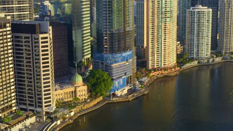 Zoom-In-Aerial-View-of-Brisbane-Riverside-with-443-Queen-Street-Residential-Building-being-under-construction-in-the-Center,-QLD-Australia