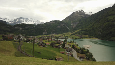 Panoramic-scenery-of-Lake-Lungern-with-old-rural-village-and-Mountains