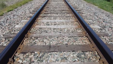 Close-up-of-travelling-down-the-railway,-low-angle-view