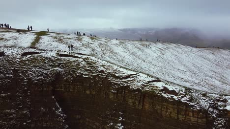 Aerial-view-Mam-Tor-in-Peak-District-England-people-at-summit-Winter