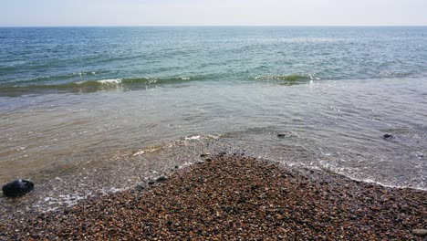 Waves-hit-the-shore-of-the-pebble-beach-in-Branscombe-on-the-English-Channel-coast