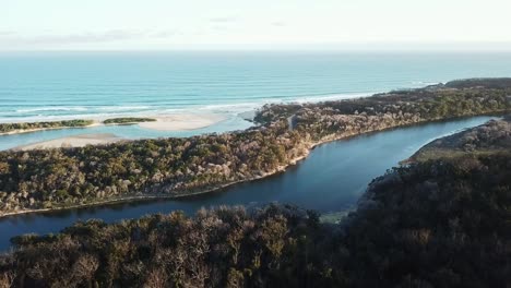 Aerial-footage-in-the-late-afternoon-over-the-mouth-of-the-Betka-River-in-eastern-Victoria,-Australia,-December-2020