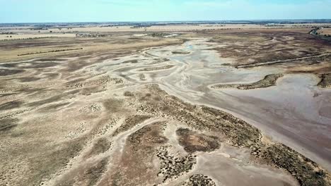 Descending-drone-footage-of-where-Tyrell-Creek-enters-Lake-Tyrell,-in-north-west-Victoria,-May-2021