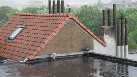 Heavy-Rain-with-lightning-on-the-rooftops-in-the-suburbs---static-slow-motion-shot