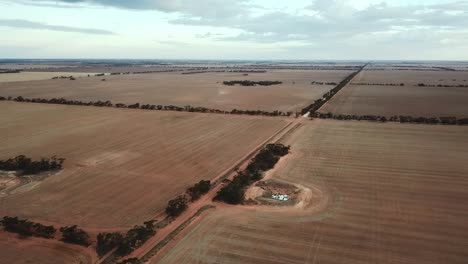 Drone-footage-over-dry-paddocks-near-Berriwillock,-Victoria,-Australia,-May-2021