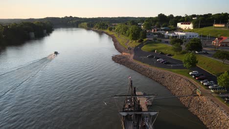 Flying-over-the-Pinta-replica,-docked-in-Clarksville,-on-the-Cumberland-River