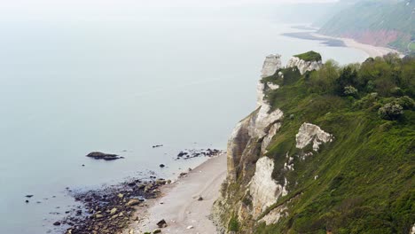 Chalk-cliffs-and-rocky-pebble-beach-of-Branscombe-on-a-very-hazy-day