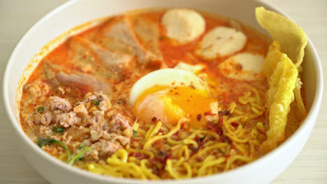 egg-noodles-with-pork-and-meatball-in-spicy-soup-or-Tom-Yum-Noodles-in-Asian-style