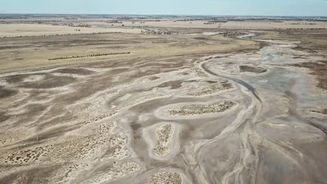 Aerial-footage-of-Tyrell-Creek-before-it-enters-Lake-Tyrell,-in-north-west-Victoria,-May-2021
