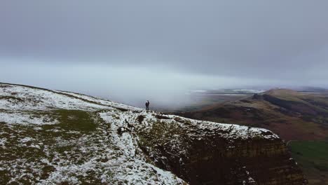Aerial-view-Mam-Tor-in-Peak-District-England-couple-at-summit-in-Winter