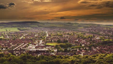 Aerial-shot-of-a-beautiful-sunset-over-the-town-of-Chapeltown-in-South-Yorkshire,-UK