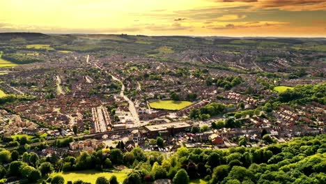 Aerial-hyperlapse-during-the-golden-hour-over-a-countryside-town-in-the-UK