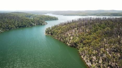 Reverse-aerial-footage-over-the-Mallacoota-Inlet,-in-eastern-Victoria,-Australia,-December-2020,-a-year-after-wildfires-affected-the-region