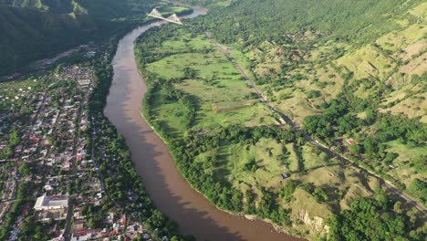 Aerial-view-of-Honda,-Colombia-and-Magdalena-River-on-sunny-day,-small-colonial-town-in-Tolima-region,-drone-shot