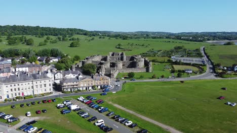 Sunny-touristic-Beaumaris-castle-town-aerial-view-ancient-Anglesey-fortress-landmark-rising-high