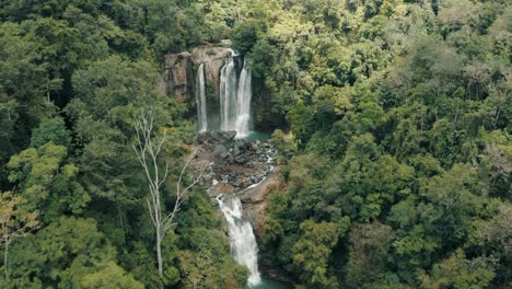Nauyaca-Waterfalls-surrounded-by-lush-greenery,-Costa-Rica