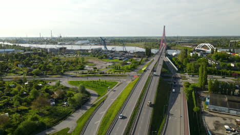 Complicated-highway-interchange-near-the-Third-Millennium-John-Paul-II-Bridge-Over-Martwa-Wisla-River-daytime-aerial-view