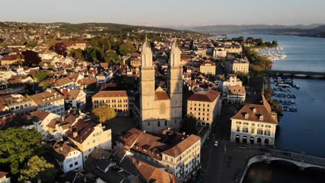 Aerial-view-of-Zurich,-Switzerland-near-Limmat-river-with-view-of-Grossmünster-church,-the-Opera,-and-Lake-Zurich