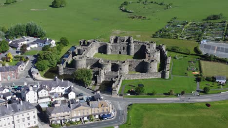 Sunny-touristic-Beaumaris-castle-town-aerial-view-ancient-Anglesey-fortress-landmark-zoom-in