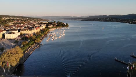 Aerial-view-of-Zurich,-Switzerland-from-the-lake's-shore-to-historical-center
