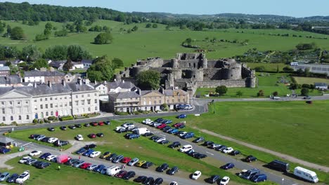 Sunny-touristic-Beaumaris-castle-town-aerial-view-ancient-Anglesey-fortress-landmark-zooming-in