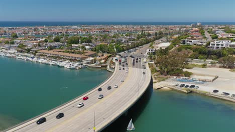 Aerial-view-of-a-bridge,-on-the-Pacific-Coast-Highway,-In-Newport-Beach,-California